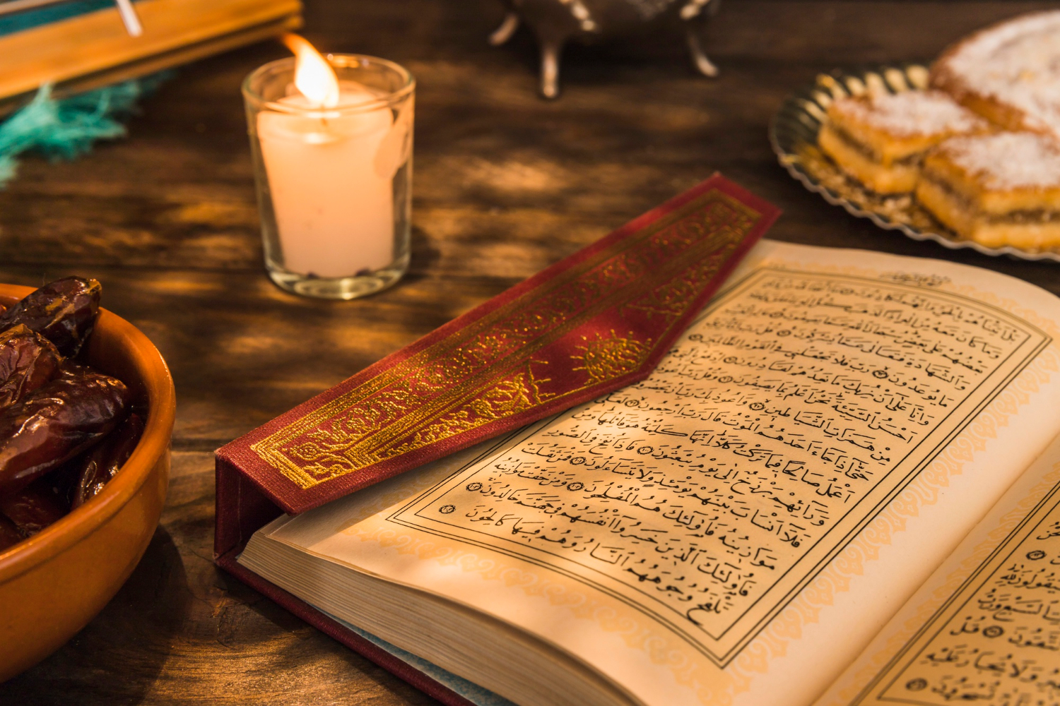 opened-quran-near-candle-sweet-dates.jpg